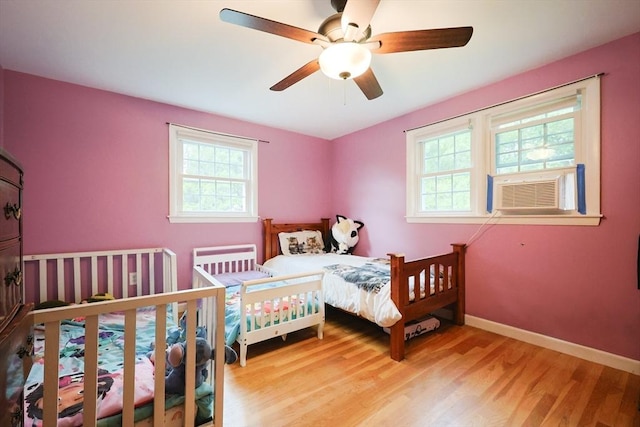 54 Mountain View Rd, Leominster, MA 01453 - bedroom featuring multiple windows, wood finished floors, cooling unit, and baseboards