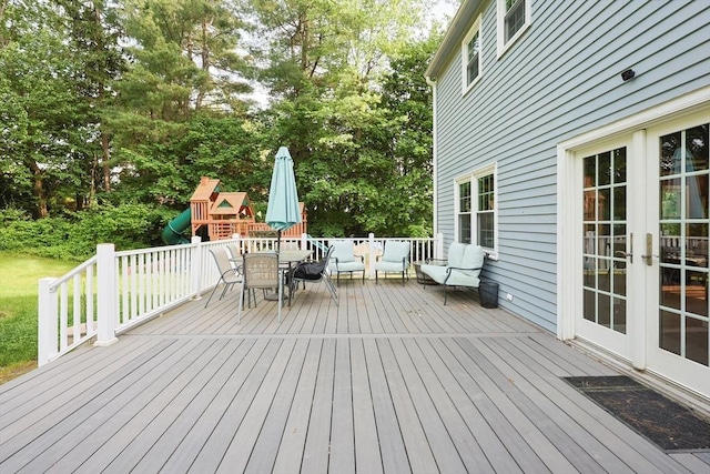 54 Mountain View Rd, Leominster, MA 01453 - wooden terrace with outdoor dining space, a playground, french doors, and view of wooded area