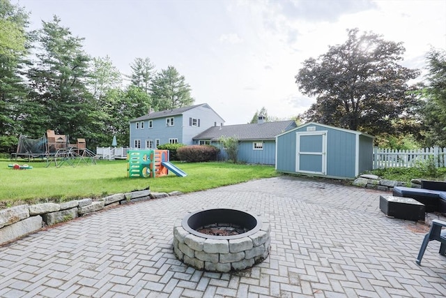 54 Mountain View Rd, Leominster, MA 01453 - view of patio featuring an outdoor fire pit, a playground, and a trampoline