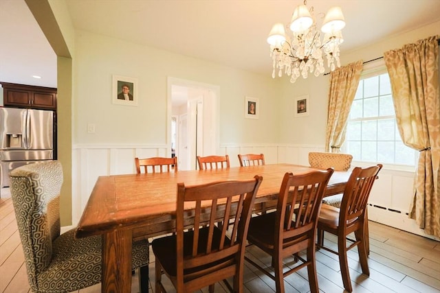 54 Mountain View Rd, Leominster, MA 01453 - dining room featuring wainscoting, a chandelier, a decorative wall, and light wood-style floors
