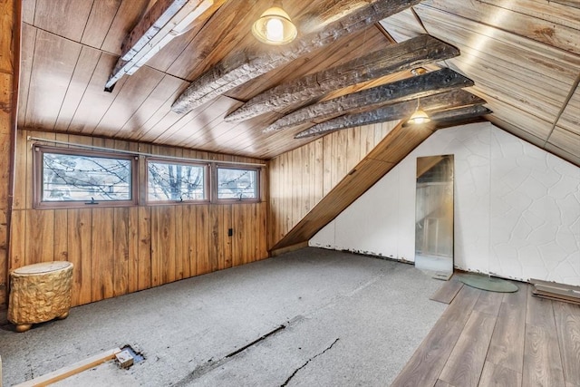 bonus room featuring lofted ceiling, wooden walls, and wooden ceiling