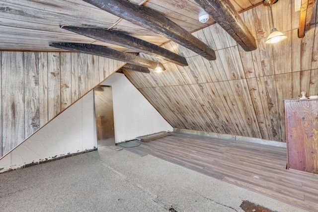 additional living space featuring lofted ceiling, wooden walls, and wooden ceiling