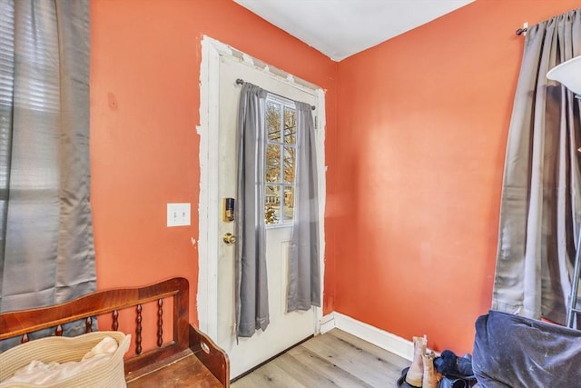 doorway with light wood-type flooring