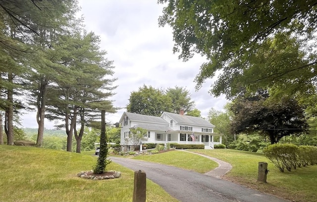 148 Scantic Rd, Hampden, MA 01036 - view of front of home with a front yard, a chimney, and asphalt driveway