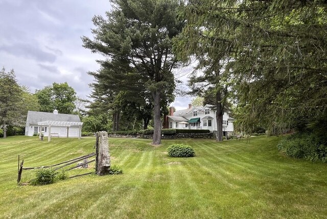 148 Scantic Rd, Hampden, MA 01036 - view of green lawn featuring a garage