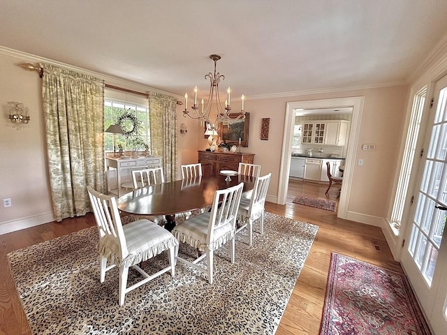 148 Scantic Rd, Hampden, MA 01036 - dining room with a chandelier, ornamental molding, and wood finished floors