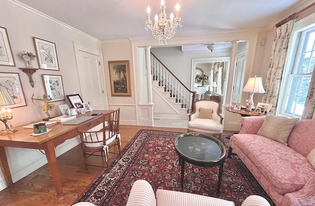 148 Scantic Rd, Hampden, MA 01036 - living room featuring wood finished floors, decorative columns, an office area, a chandelier, and a decorative wall