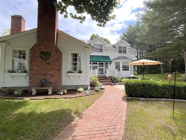 148 Scantic Rd, Hampden, MA 01036 - view of front of home with a front lawn and a chimney