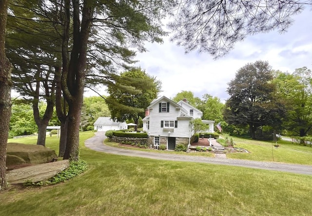 148 Scantic Rd, Hampden, MA 01036 - view of front of home featuring a front lawn and a chimney