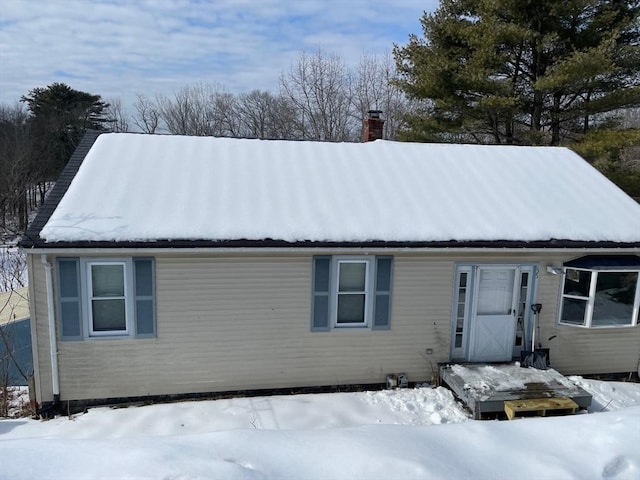 view of front of home with a chimney