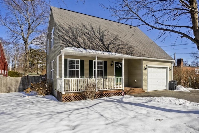 view of front facade with a garage and a porch