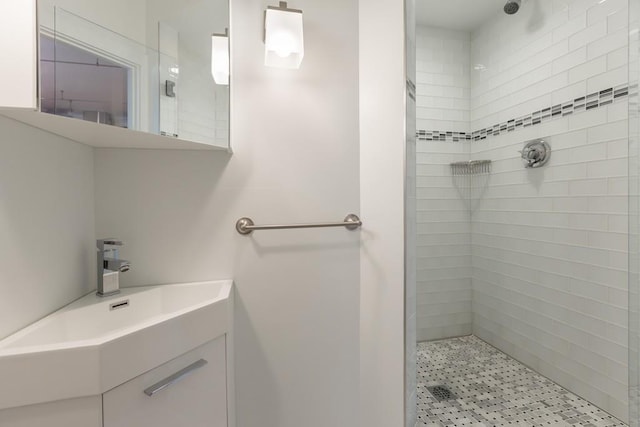 bathroom featuring a shower stall and vanity