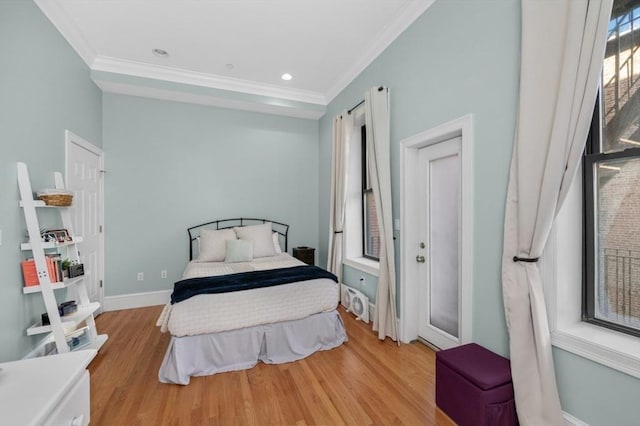 bedroom featuring recessed lighting, ornamental molding, baseboards, and wood finished floors