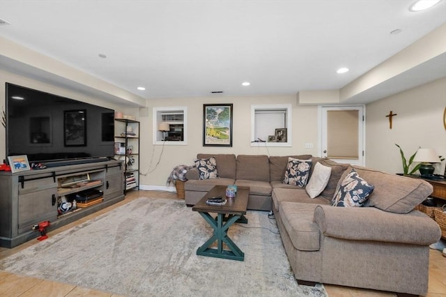 living area with visible vents, recessed lighting, and baseboards