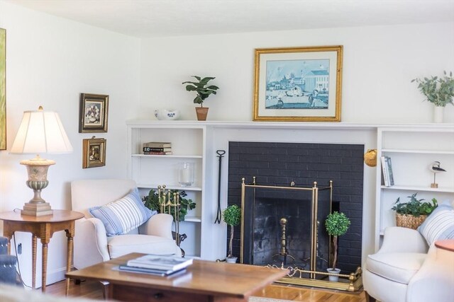 sitting room featuring wood finished floors and a fireplace
