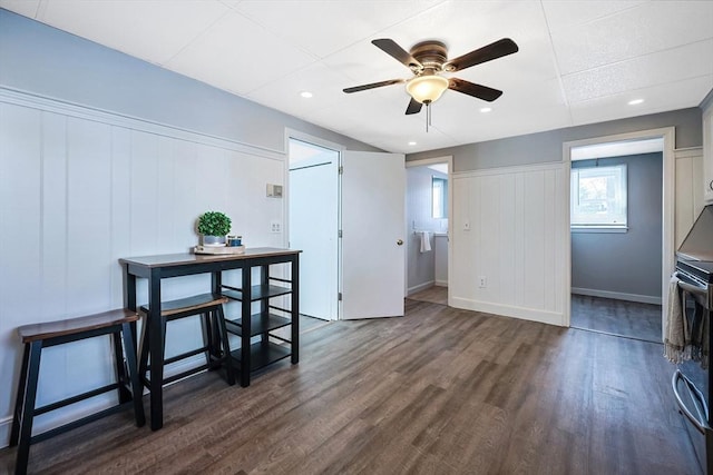 dining space with dark wood-type flooring and ceiling fan