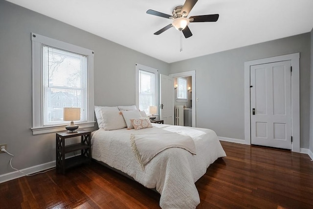 bedroom with dark wood-type flooring, ceiling fan, and multiple windows