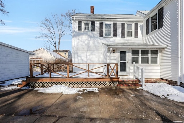 view of front of property with a wooden deck