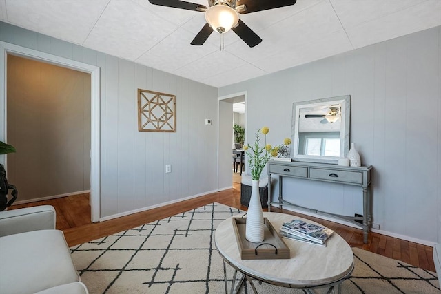 sitting room featuring hardwood / wood-style flooring and ceiling fan