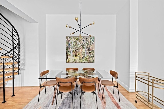 203 Middle St Unit 6, Weymouth, MA 02189 - dining area with a chandelier, wood finished floors, stairs, and baseboards
