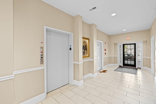 203 Middle St Unit 6, Weymouth, MA 02189 - foyer featuring baseboards, recessed lighting, elevator, and light tile patterned flooring