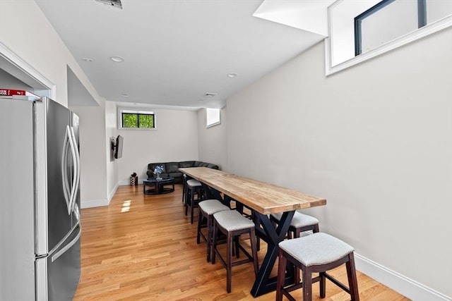 203 Middle St Unit 6, Weymouth, MA 02189 - dining area with light wood-style flooring and baseboards