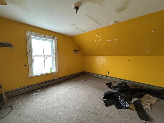 additional living space with lofted ceiling and baseboard heating