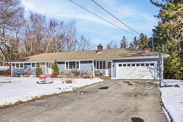 ranch-style home featuring a garage