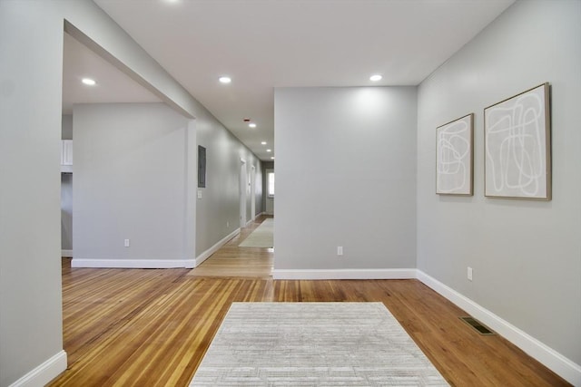 spare room featuring wood-type flooring