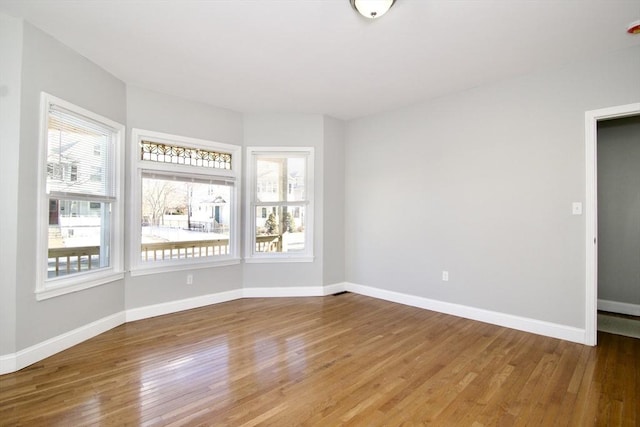 empty room featuring wood-type flooring