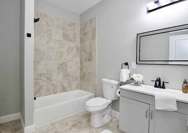 full bathroom featuring tiled shower / bath combo, vanity, and toilet