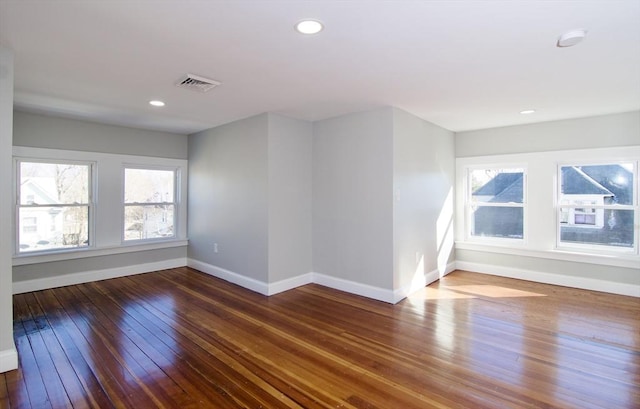 unfurnished room with wood-type flooring