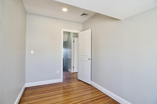 empty room featuring wood-type flooring