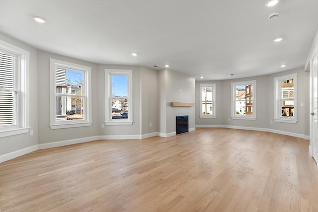 unfurnished living room with light hardwood / wood-style flooring