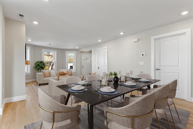 dining space with light hardwood / wood-style floors