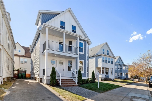 view of front of property with a balcony