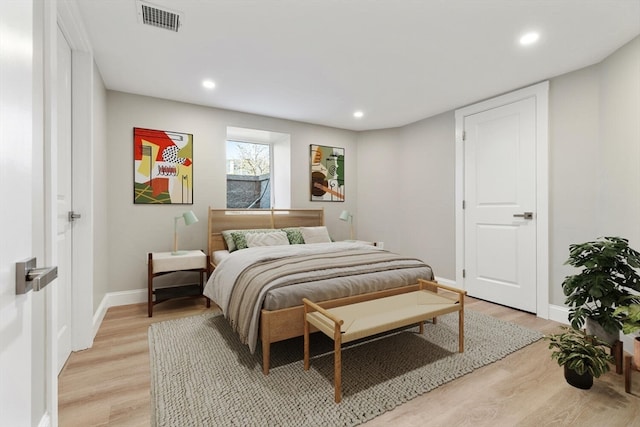 bedroom with light wood-type flooring