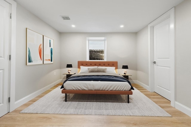 bedroom with light hardwood / wood-style flooring