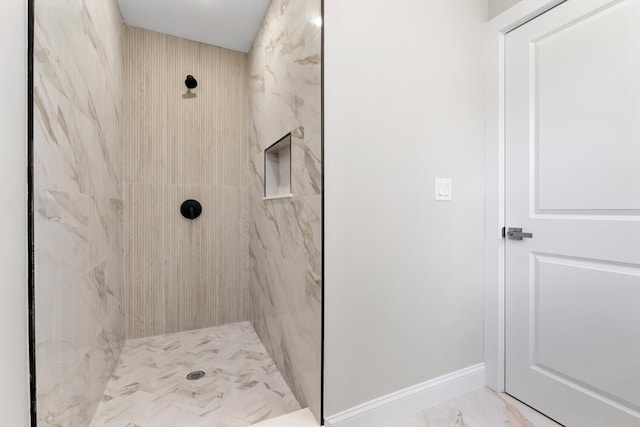 bathroom featuring tiled shower