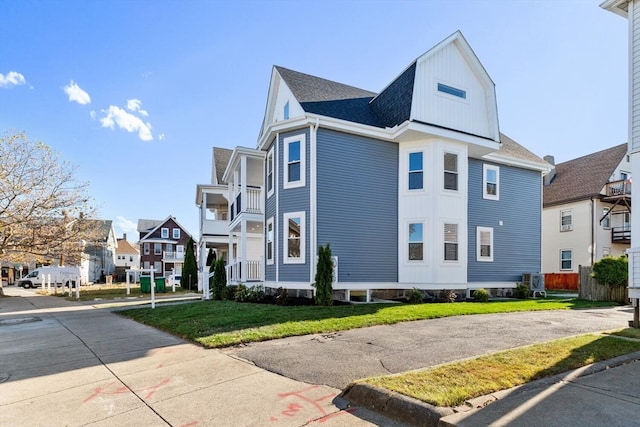 view of side of property with a lawn