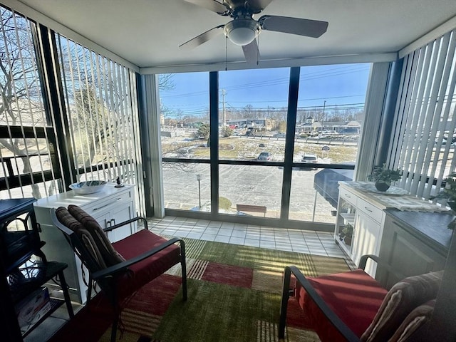 sunroom with a ceiling fan and a healthy amount of sunlight