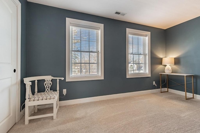 sitting room with a healthy amount of sunlight and carpet floors