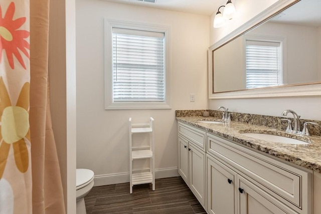 bathroom with vanity and toilet