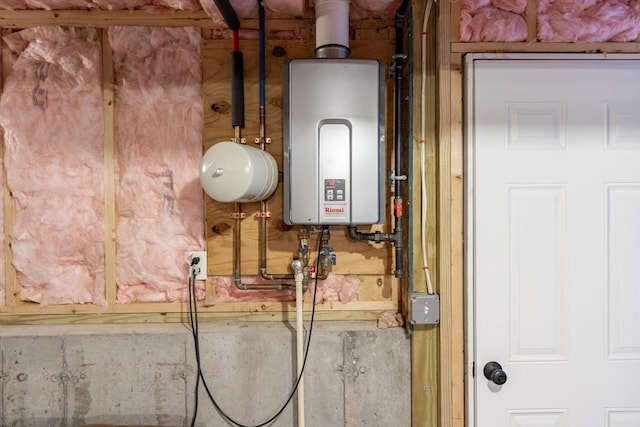 utility room with tankless water heater