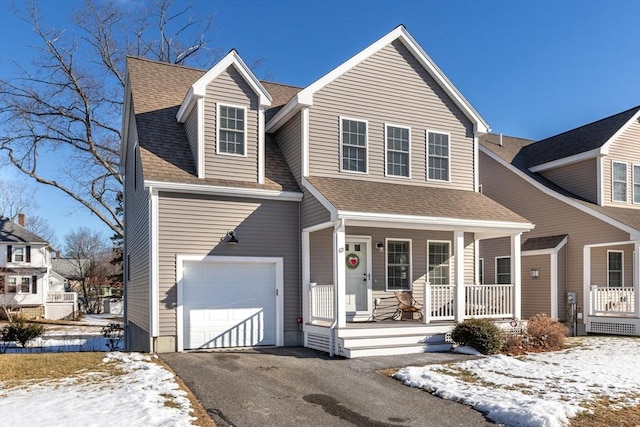 view of front of home featuring a garage and a porch