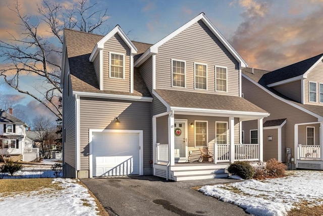 view of front of home with a garage and covered porch