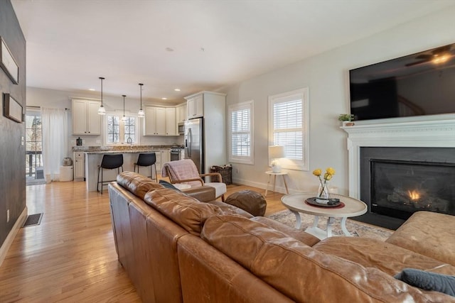 living room with light hardwood / wood-style floors