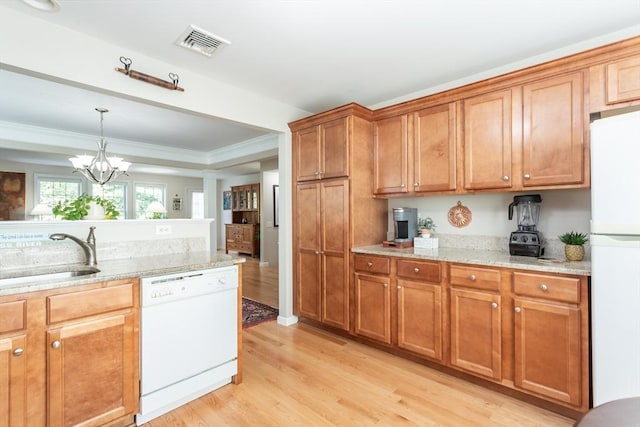 21 Harbor Mist Dr Unit 21, Fairhaven, MA 02719 - kitchen with white appliances, light wood-style flooring, brown cabinetry, a chandelier, and decorative light fixtures
