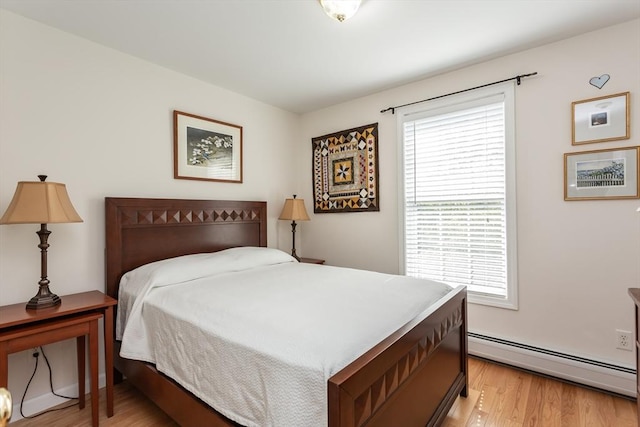 21 Harbor Mist Dr Unit 21, Fairhaven, MA 02719 - bedroom featuring baseboard heating, multiple windows, and light wood-style floors