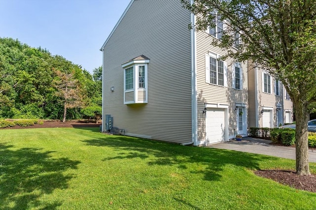 21 Harbor Mist Dr Unit 21, Fairhaven, MA 02719 - view of side of property with a lawn, driveway, and a garage